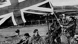 British troops raise the Union flag on the Falklands