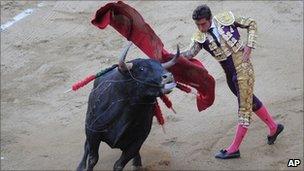 Spanish matador David Fandilla, "El Fandi" makes a pass at the Monumental bullring in Barcelona, Spain, Sunday, July 25, 2010.