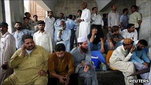 Relatives of the victims gather at the Pakistan Institute of Medical Sciences Hospital in Islamabad