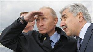 Russian Prime Minister Vladimir Putin and Sukhoi head Mikhail Pogosyan during a test flight of a new fighter jet