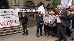 Protesters ahead of the council meeting