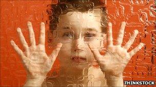 Autism - child behind glass - posed by model