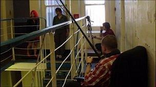 Cast and crew filming in the prison