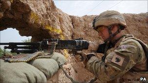 A soldier keeps watch from a newly occupied compound in Helmand (pic supplied by MoD)