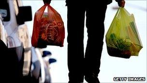 Man carrying plastic bags