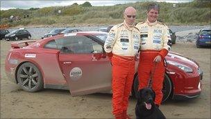 Mike Newman, his father, also called Mike, and guide dog Baxter