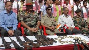 Indian police with captured Ulfa weapons