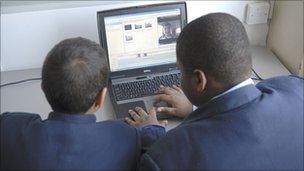 pupils using laptop