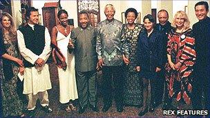 Nelson Mandela (centre) with Charles Taylor and Naomi Campbell directly to his right