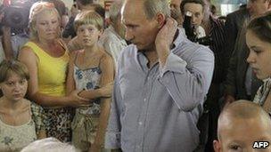 Russian Prime Minister Vladimir Putin meets people displaced by fires in Voronezh, 4 August