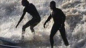 Surfers on Severn Bore