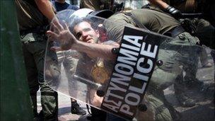 Man being arrested during recent protests in Athens against the Greek austerity measures