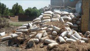 Waterlogged wheat store in Ziauddinabad village