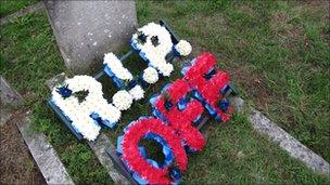 Gravestone and flowers