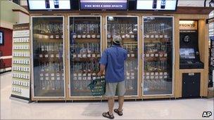 A shopper examines one of the wine vending machines at a Pennsylvania supermarket - 25 June 2010