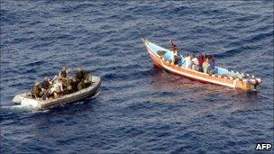 Pirates surrendering to crew of SPS Victoria