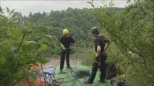 People setting up slide