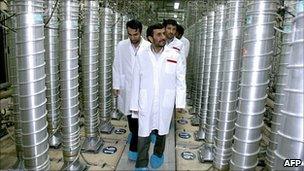 Iranian President Mahmoud Ahmadinejad walks past centrifuges at the Natanz uranium enrichment facilities (2008)