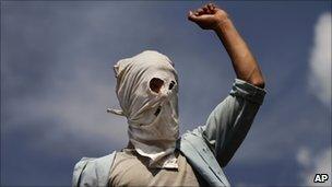 A masked Kashmiri Muslim protester