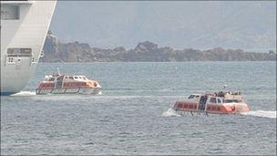 Liberty boats taking passengers from the cruise ship the Crown Princess to and from Guernsey's St Peter Port Harbour