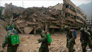 Chinese soldiers spray disinfectant in Zhouqu on 11 August 2010