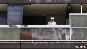 A man on the balcony of the Heygate estate