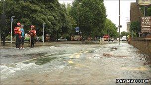 Water gushing out of burst water main