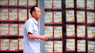 A mn walks part a real estate agents in Beijing