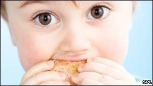 Toddler eating doughnut