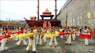 Sri Lankan dancers perform at the site of a new port under construction at the southern town of Hambantota, Sri Lanka