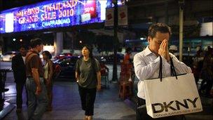 A Thai man prays at the Buddhist Erawan shrine at Rachaprasong square in Bangkok