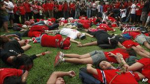 Members of the United Front for Democracy against Dictatorship (UDD) or Red Shirt stage die-in at Lumpini park Sunday 25 July 2010 in Bangkok