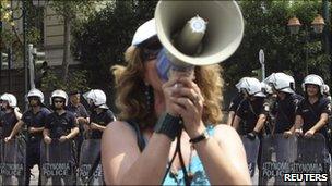 A protester shouts slogans during a rally in Athens