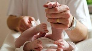 Dad changing a nappy