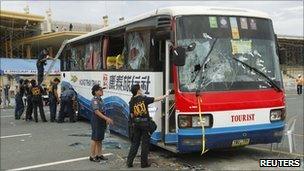 Police examining the hijacked bus