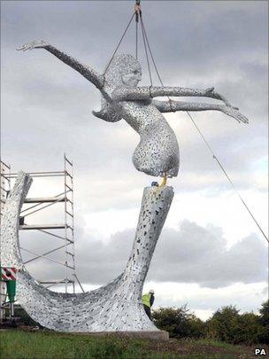 Sculpture being lifted into place