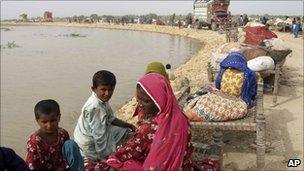 Pakistani villagers whose houses are submerged by floodwater live on an embankment in Thatta near Hyderabad, Pakistan - 26 August 2010