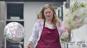 Woman delivers flowers for Samantha Cameron