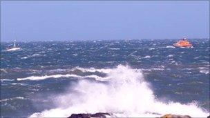 The Breaksea Light is towed by the Holyhead RNLI lifeboat