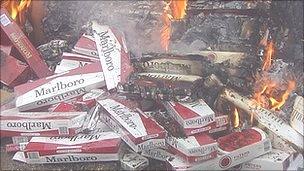 Counterfeit cigarettes being burned