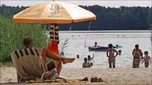 Man under parasol, Germany