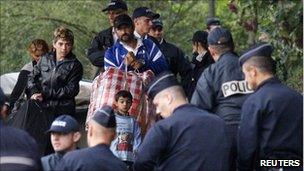 French police evacuate a Roma family from an illegal camp in Mons en Baroeul, near Lille, northern France, on 26 August, 2010