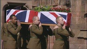 Darren Foster's coffin is carried from the cathedral