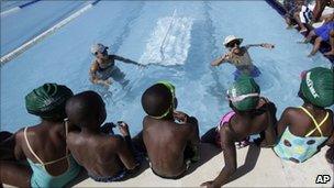 Black children in a swimming lesson