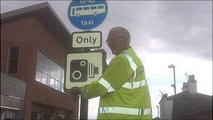 Councillor Stan Waddington with CCTV warning sign