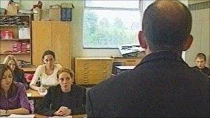 A male teacher in a classroom