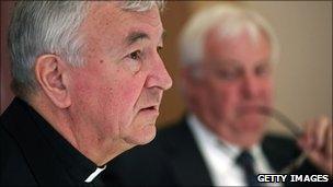 Lord Chris Patten (right) looks on as Archbishop Vincent Nichols speaks during a press conference in London, 5 July 2010