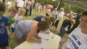 People signing maternity closure petition