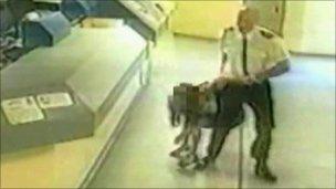Andrews dragging Pamela Somerville to the cell