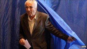 Voter leaves polling booth in Chisinau, Moldova - 5 September 2010